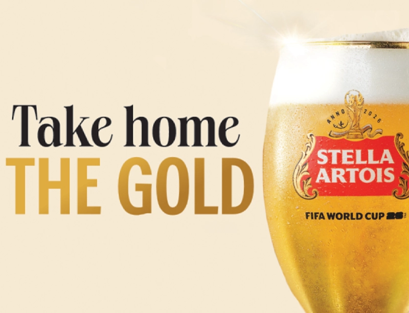 glass of Stella Artois beer with 'take home the gold' text