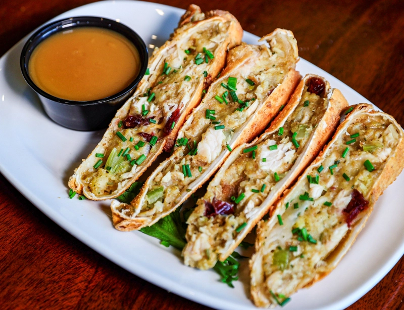 egg rolls with roast turkey and stuffing with a side of gravy